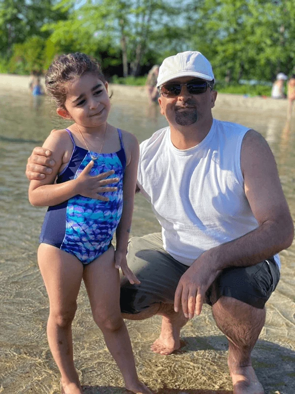Dad and daughter enjoying the water
