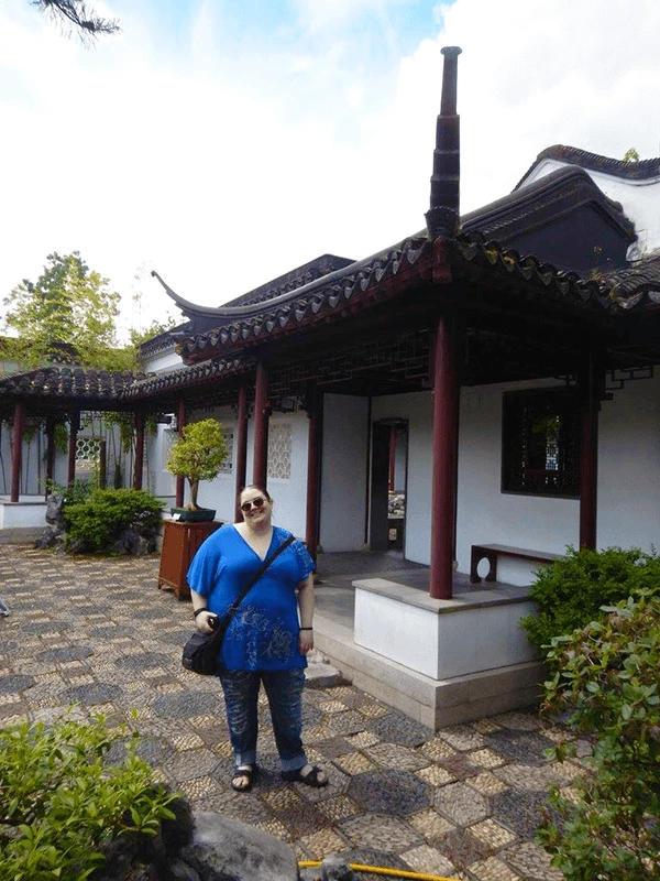 emily in front of chinese buildings